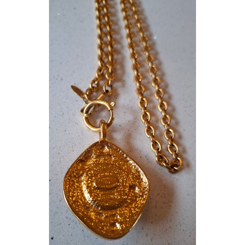 1 - Chanel-A 1980's gold tone necklace having an open link chain and rhombus shaped pendant with central... 