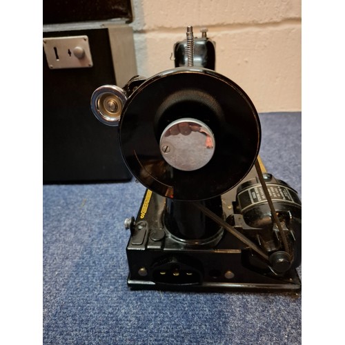 37 - A 1951 Singer 221K electric featherweight sewing machine in original fitted case with accessories an... 