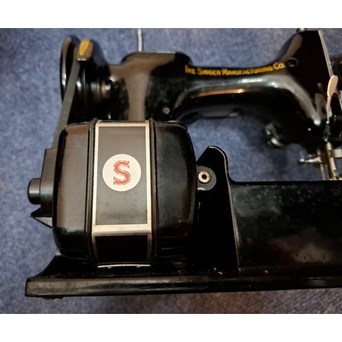 37 - A 1951 Singer 221K electric featherweight sewing machine in original fitted case with accessories an... 