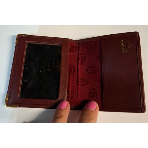9 - Cartier- A Must de Cartier burgundy leather single card/mirror wallet with original box and fabric p... 