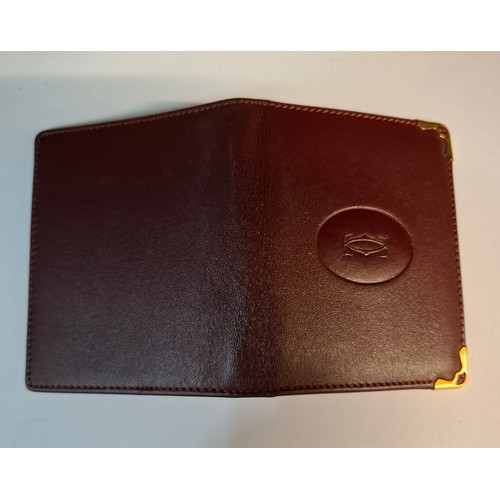 9 - Cartier- A Must de Cartier burgundy leather single card/mirror wallet with original box and fabric p... 