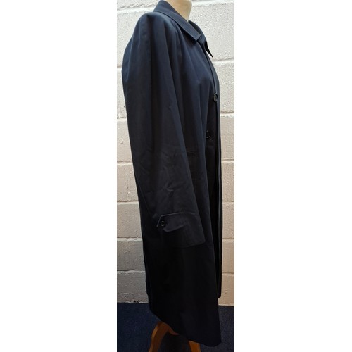 13 - Burberrys- A late 20th Century navy Camden Heritage car coat, size 46 long with navy tartan lining. ... 