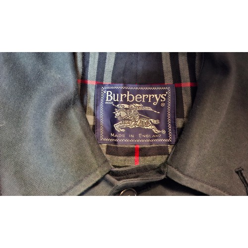 13 - Burberrys- A late 20th Century navy Camden Heritage car coat, size 46 long with navy tartan lining. ... 