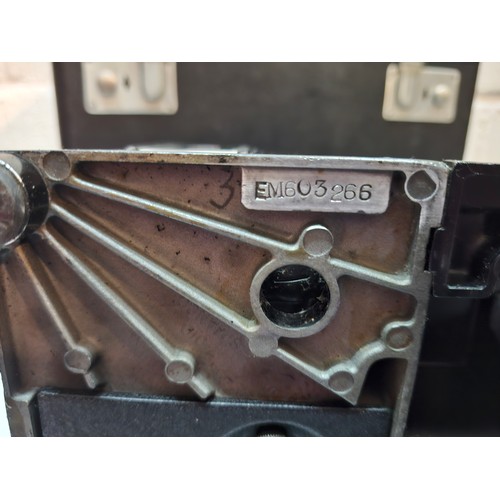 38 - A 1957 Singer Featherweight 222K electric sewing machine having a black travel case together with a ... 