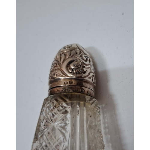 39 - A collection of 10 mixed cut glass dressing table scent bottles and jars, all with silver collars/li... 