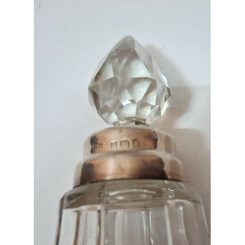 39 - A collection of 10 mixed cut glass dressing table scent bottles and jars, all with silver collars/li... 