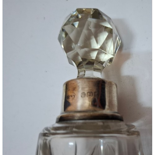 39 - A collection of 10 mixed cut glass dressing table scent bottles and jars, all with silver collars/li... 