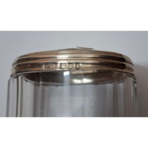 39 - A collection of 10 mixed cut glass dressing table scent bottles and jars, all with silver collars/li... 