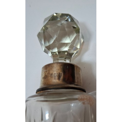 39 - A collection of 10 mixed cut glass dressing table scent bottles and jars, all with silver collars/li... 