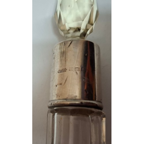 39 - A collection of 10 mixed cut glass dressing table scent bottles and jars, all with silver collars/li... 