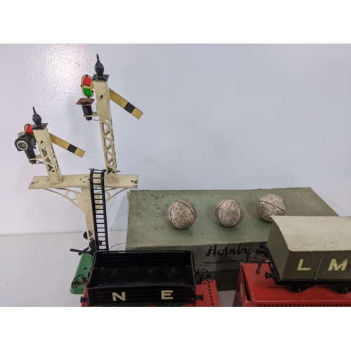 42 - Seven boxed Hornby freight carriages, some with N.E. G.W L.M.S markings on the side and a large sign... 