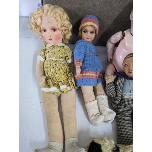 46 - Six dolls and a large collection of accessories and clothing, one of the dolls - A gentleman 011 Lup... 