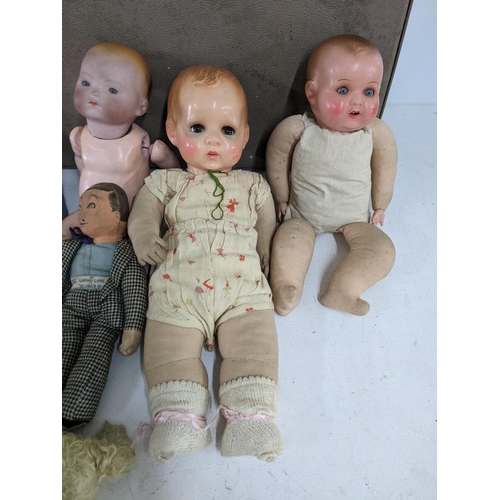 46 - Six dolls and a large collection of accessories and clothing, one of the dolls - A gentleman 011 Lup... 