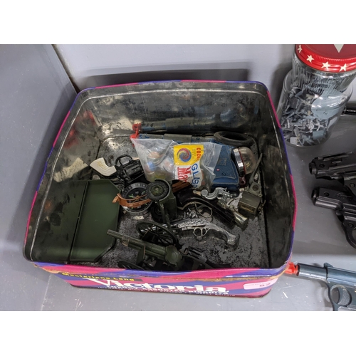 52 - Toy firearms and toy figures to include a model Luger, a Sekiden Automatic SAP 50 model and others
L... 