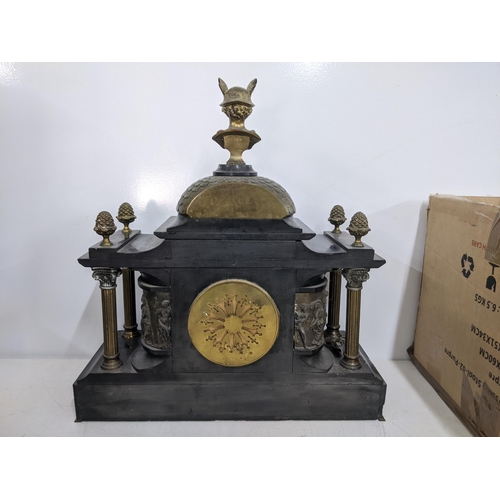 53 - A late Victorian black slate mantle clock of architectural form, surmounted with a bust of Mercury o... 