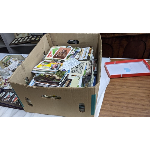 5 - A large mixed lot containing postcards, stamp albums and cigarette cards
Location: A1F
If there is n... 
