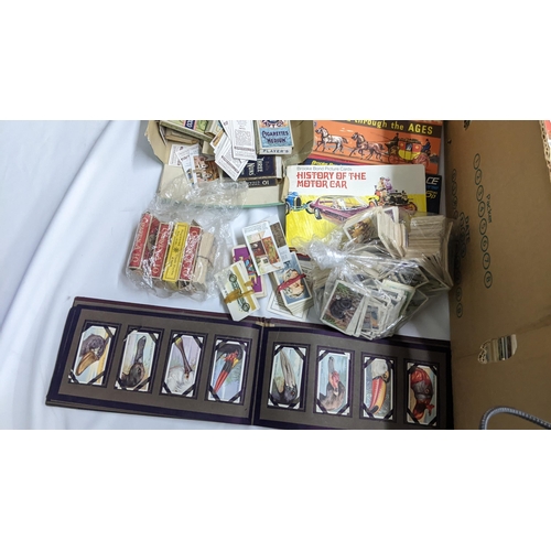 5 - A large mixed lot containing postcards, stamp albums and cigarette cards
Location: A1F
If there is n... 