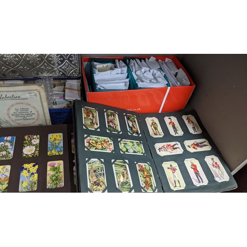 5 - A large mixed lot containing postcards, stamp albums and cigarette cards
Location: A1F
If there is n... 