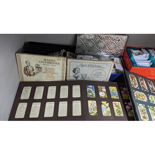 5 - A large mixed lot containing postcards, stamp albums and cigarette cards
Location: A1F
If there is n... 