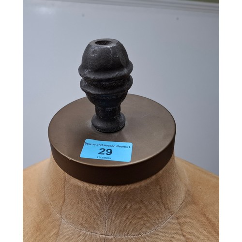 29 - An American Fusion USA tan calico shop mannequin/torso in male form on an adjustable cast metal base... 