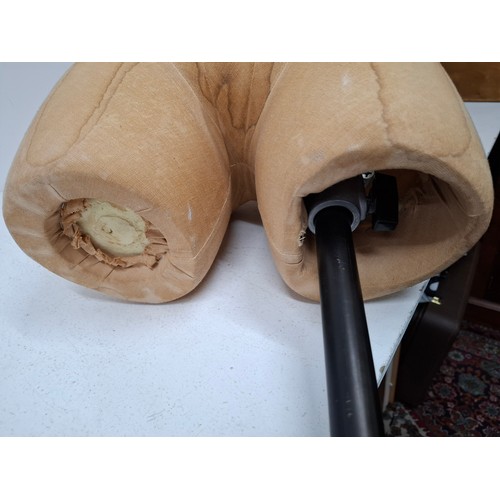 29 - An American Fusion USA tan calico shop mannequin/torso in male form on an adjustable cast metal base... 