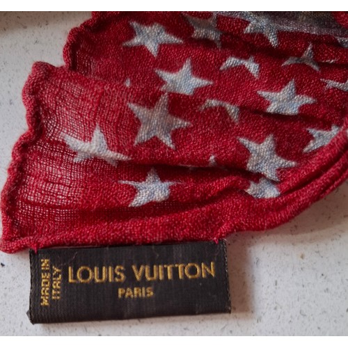18 - Louis Vuitton- A 2005 ruched silk and linen mix scarf depicting red, white and blue stars and LV mon... 