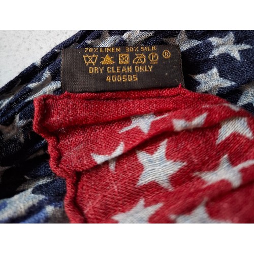 18 - Louis Vuitton- A 2005 ruched silk and linen mix scarf depicting red, white and blue stars and LV mon... 