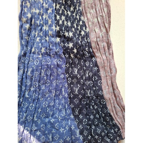 18 - Louis Vuitton- A 2005 ruched silk and linen mix scarf depicting red, white and blue stars and LV mon... 