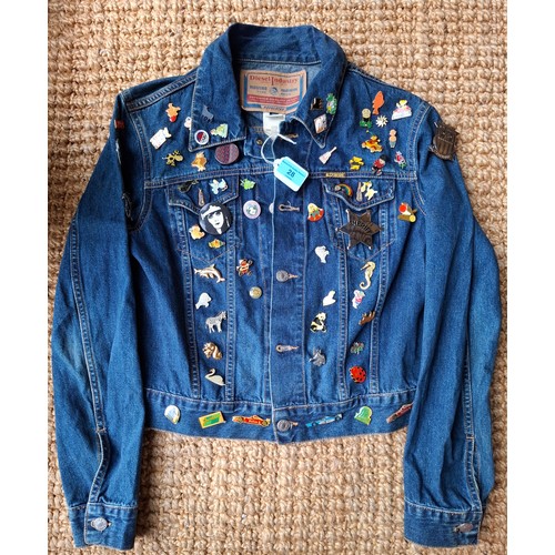 28 - A Diesel Industry denim jacket, size M, covered both front and back in pin badges to include car rac... 