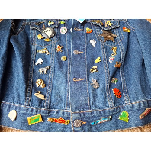 28 - A Diesel Industry denim jacket, size M, covered both front and back in pin badges to include car rac... 
