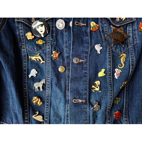 28 - A Diesel Industry denim jacket, size M, covered both front and back in pin badges to include car rac... 