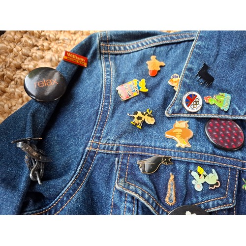 28 - A Diesel Industry denim jacket, size M, covered both front and back in pin badges to include car rac... 