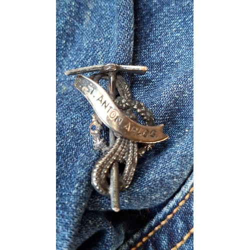 28 - A Diesel Industry denim jacket, size M, covered both front and back in pin badges to include car rac... 