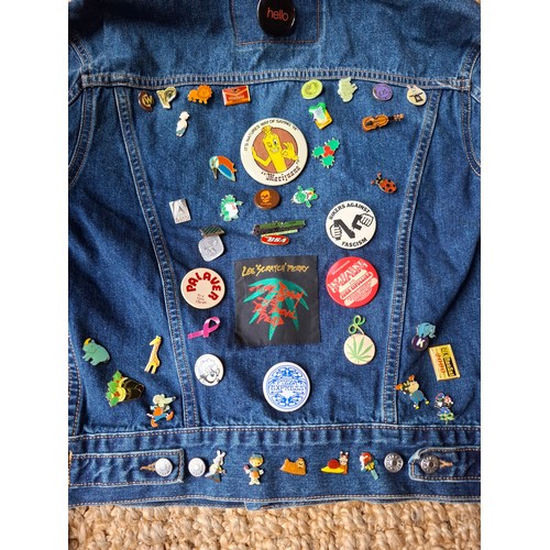 28 - A Diesel Industry denim jacket, size M, covered both front and back in pin badges to include car rac... 