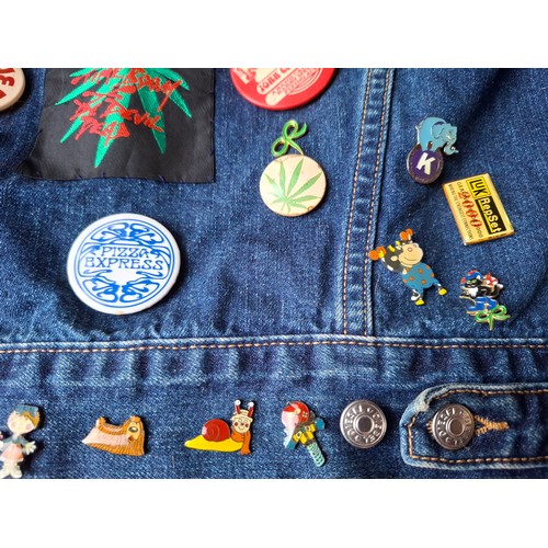 28 - A Diesel Industry denim jacket, size M, covered both front and back in pin badges to include car rac... 