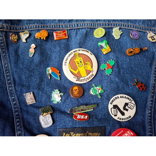 28 - A Diesel Industry denim jacket, size M, covered both front and back in pin badges to include car rac... 