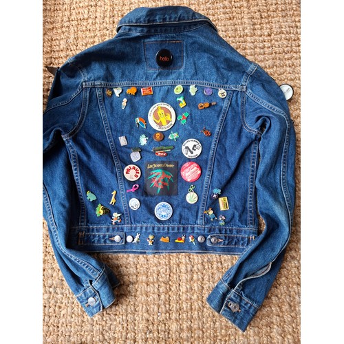 28 - A Diesel Industry denim jacket, size M, covered both front and back in pin badges to include car rac... 