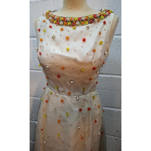 11 - Hardy Amies- A vintage cream sleeveless ball gown A/F approx 32