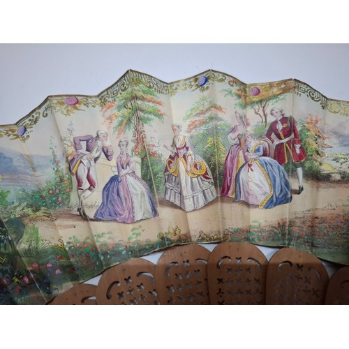 32 - A 19th Century unsigned and painted double-sided fan with wooden guards and A/F depicting courting f... 