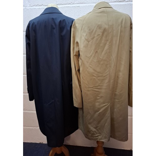 33 - Aquascutum- A navy trench coat, sold at Harrods, size 38 Short, having a tartan lining together with... 