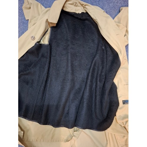 33 - Aquascutum- A navy trench coat, sold at Harrods, size 38 Short, having a tartan lining together with... 