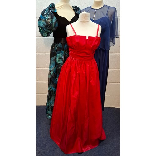 34 - Three 1970's/80's ball gowns comprising a Trina Lewis & Marjon Couture navy dress with pink sequin s... 