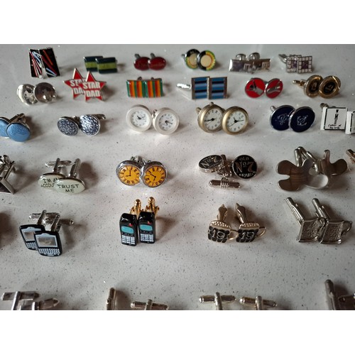 35 - Three pairs of Paul Smith cufflinks, a pair of silver tone Dunhill cufflinks and others to include n... 