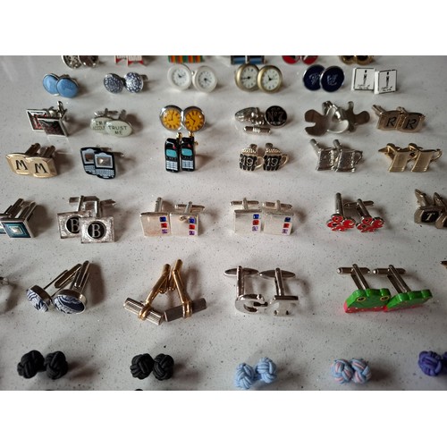 35 - Three pairs of Paul Smith cufflinks, a pair of silver tone Dunhill cufflinks and others to include n... 