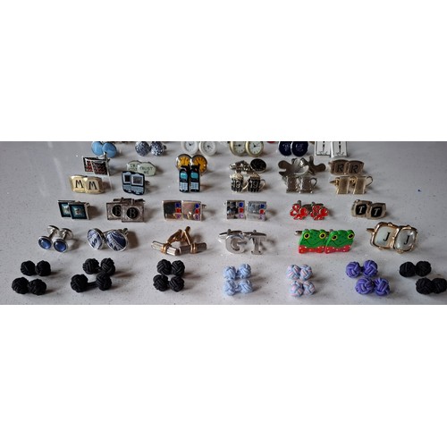 35 - Three pairs of Paul Smith cufflinks, a pair of silver tone Dunhill cufflinks and others to include n... 