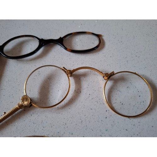 60 - Three pairs of early 20th Century yellow metal spectacles and a faux tortoiseshell pair
Location: A4... 