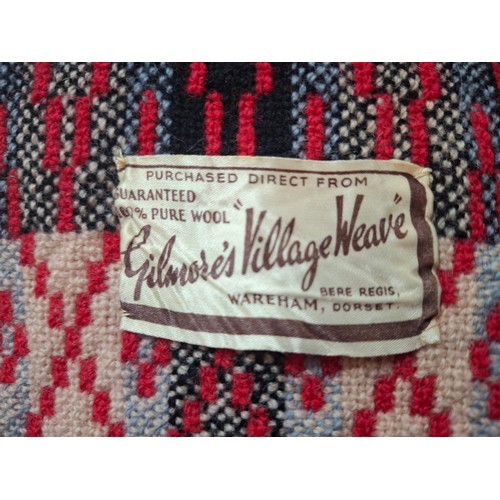 61 - A 1960's red ground Gilmores Village Weave reversible wool blanket, approx 66