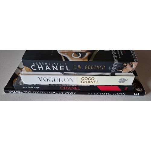 12 - Chanel-Four coffee table books to include Vogue on Coco Chanel. Location:R1.1
If there is no conditi... 