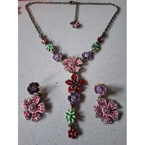 29 - Butler & Wilson- Two floral suites comprising a yellow crystal floral necklace on silver tone chain ... 