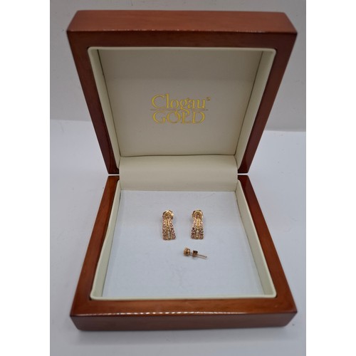 53 - A pair of Clogau 9ct gold and rose gold earrings with 3 inset white stones to each earring having 9c... 